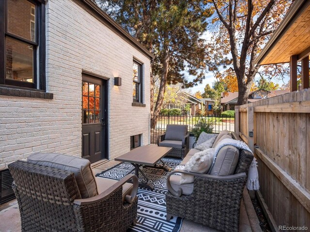 wooden terrace with outdoor lounge area