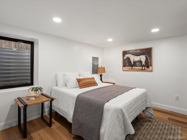 bedroom featuring hardwood / wood-style floors