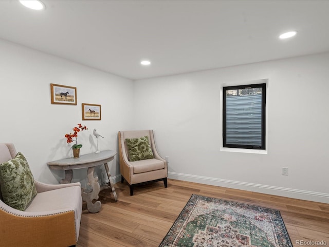 sitting room with light hardwood / wood-style floors