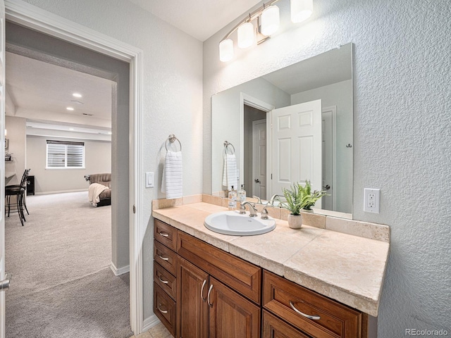 19379 W 57th Pl, Golden, CO 80403 - bathroom featuring vanity and a textured wall