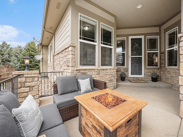 19379 W 57th Pl, Golden, CO 80403 - view of patio with an outdoor living space with a fire pit
