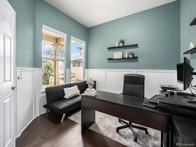 19379 W 57th Pl, Golden, CO 80403 - office space featuring a decorative wall, a textured wall, dark wood-type flooring, and a wainscoted wall