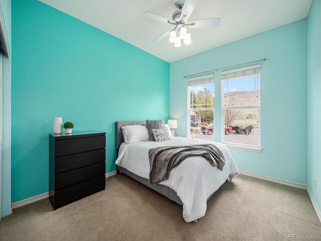 19379 W 57th Pl, Golden, CO 80403 - bedroom with baseboards, ceiling fan, and carpet floors