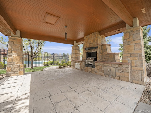 19379 W 57th Pl, Golden, CO 80403 - view of patio with grilling area, exterior kitchen, fence, and visible vents
