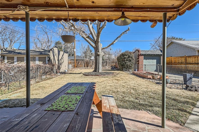 view of yard featuring an outbuilding and a fenced backyard