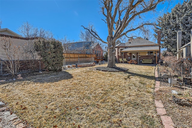 view of yard with a patio area and a fenced backyard