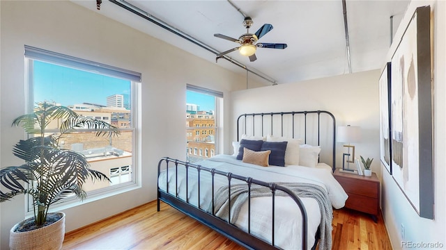 bedroom featuring light hardwood / wood-style floors and ceiling fan