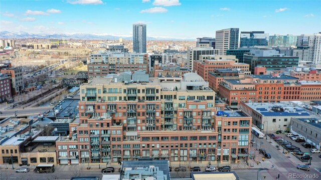 property's view of city featuring a mountain view