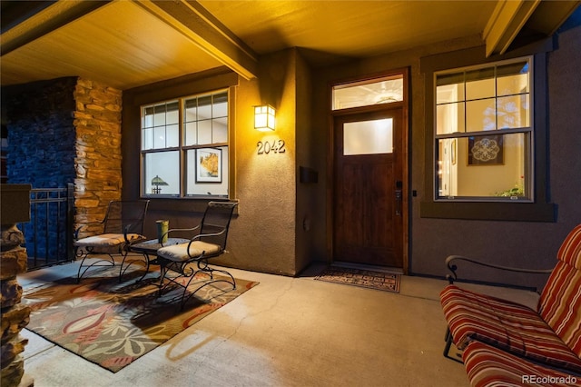 doorway to property featuring covered porch