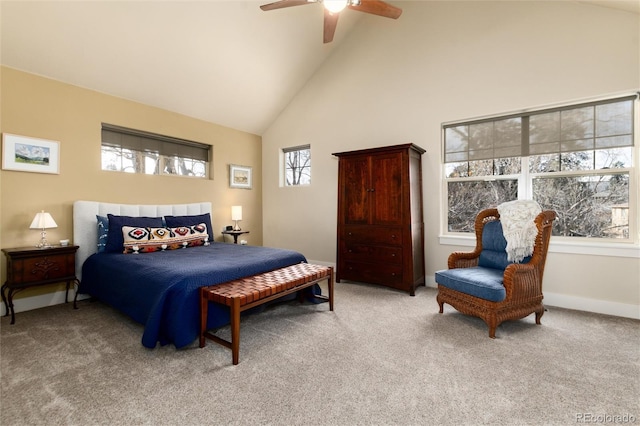 bedroom featuring a ceiling fan, baseboards, carpet floors, and high vaulted ceiling