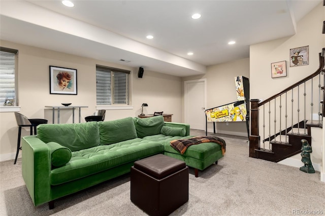 carpeted living area with stairs, visible vents, recessed lighting, and baseboards