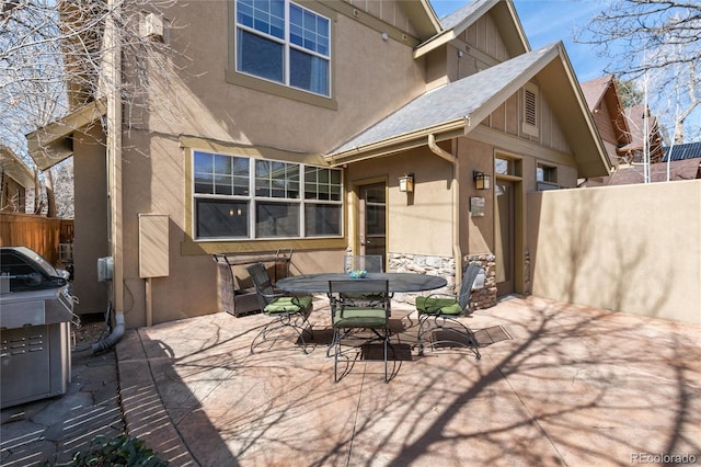 view of patio / terrace with outdoor dining space and fence