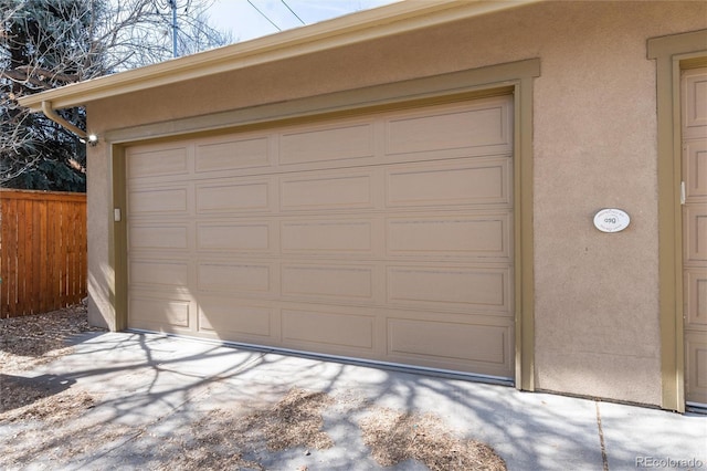 garage featuring fence