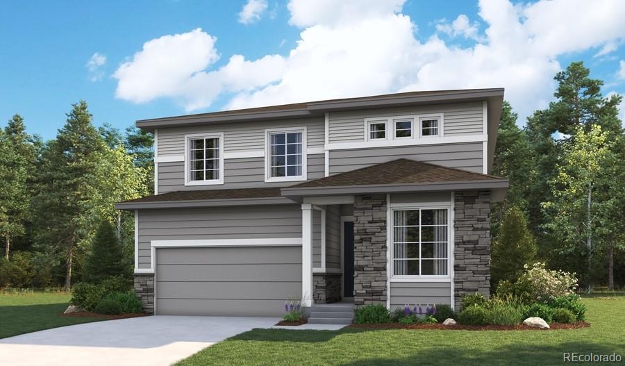 view of front of house featuring a front yard and a garage