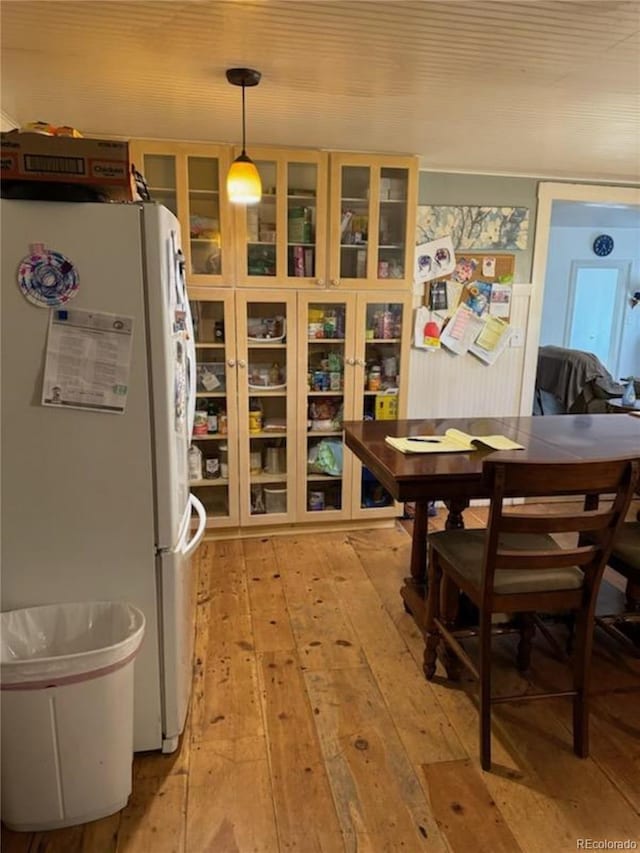 interior space featuring light hardwood / wood-style floors and white fridge