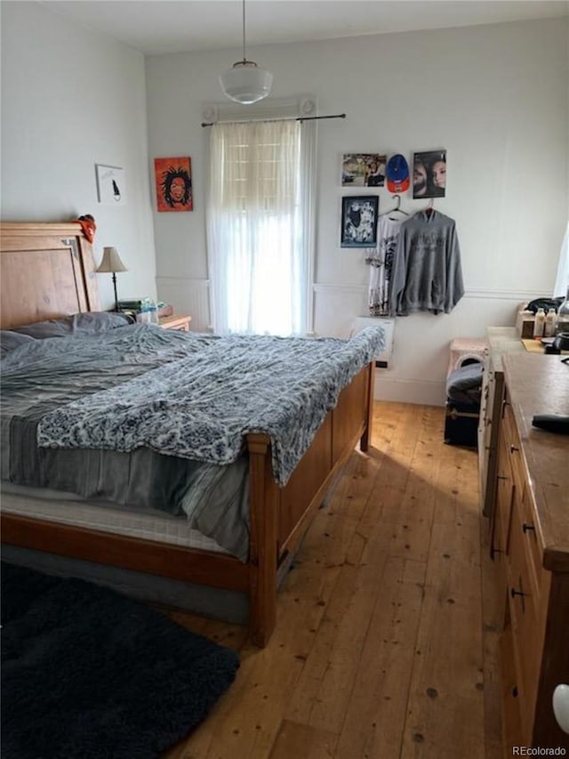 bedroom with light hardwood / wood-style floors