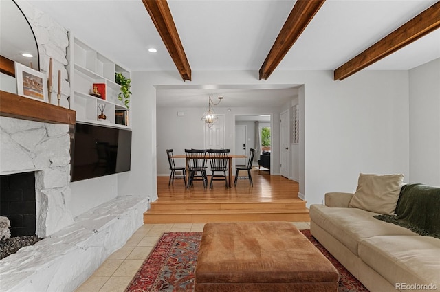 living room with beamed ceiling, a fireplace, light tile patterned flooring, recessed lighting, and baseboards