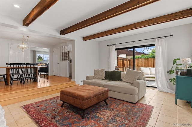 living room featuring light tile patterned floors, a chandelier, beamed ceiling, and recessed lighting