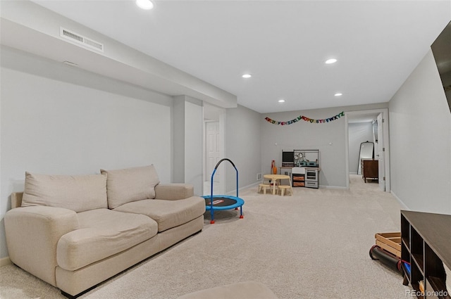 living area featuring recessed lighting, baseboards, and carpet floors