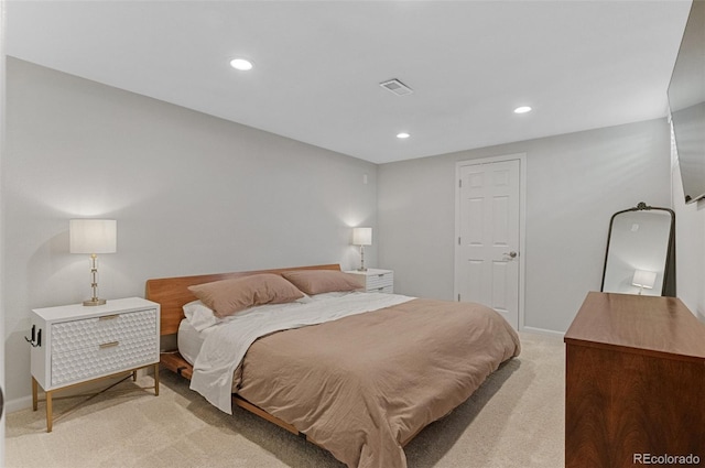 bedroom featuring light colored carpet, recessed lighting, and baseboards
