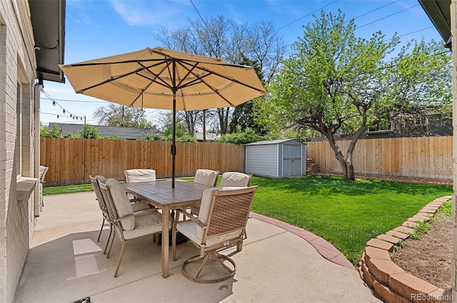 view of patio / terrace with outdoor dining space, a storage shed, and an outdoor structure