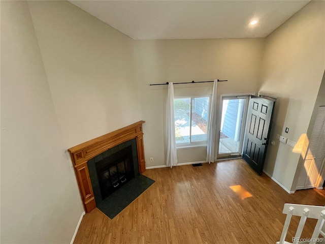 7240 W Yale Ave, Denver, CO 80227 - foyer with wood finished floors and a fireplace with flush hearth