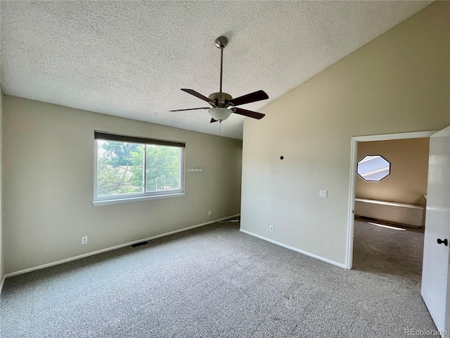 7240 W Yale Ave, Denver, CO 80227 - spare room featuring a textured ceiling, carpet flooring, a ceiling fan, and lofted ceiling