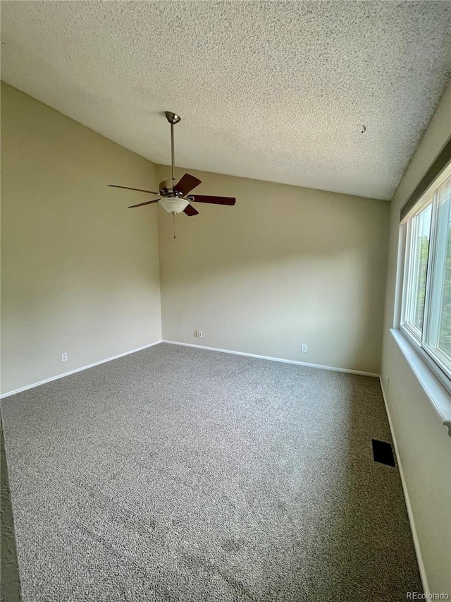 7240 W Yale Ave, Denver, CO 80227 - unfurnished room with ceiling fan, carpet floors, a textured ceiling, and vaulted ceiling