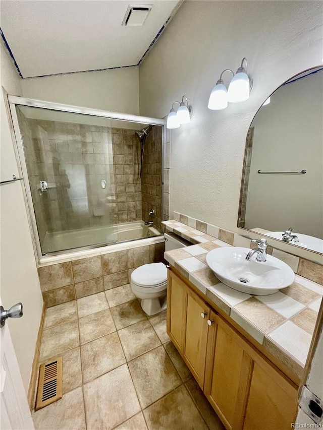 7240 W Yale Ave, Denver, CO 80227 - full bath with vanity, tiled shower / bath combo, tile patterned floors, and lofted ceiling