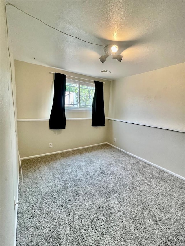 7240 W Yale Ave, Denver, CO 80227 - carpeted spare room with a textured ceiling and baseboards