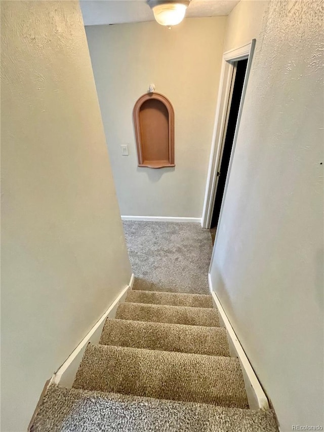 7240 W Yale Ave, Denver, CO 80227 - stairs featuring carpet floors and baseboards