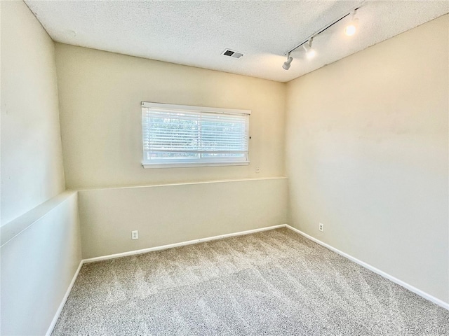 7240 W Yale Ave, Denver, CO 80227 - carpeted empty room with track lighting and a textured ceiling