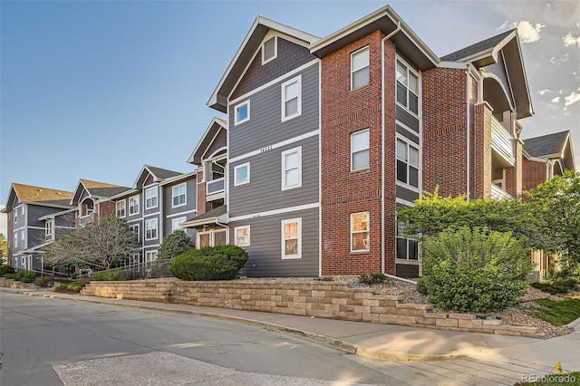 14221 E 1st Dr Unit 303, Aurora, CO 80011 - view of building exterior with a residential view