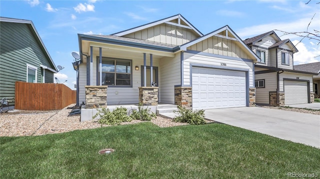 1086 Johnson St, Wiggins, CO 80654 - craftsman-style home with stone siding, board and batten siding, an attached garage, and concrete driveway