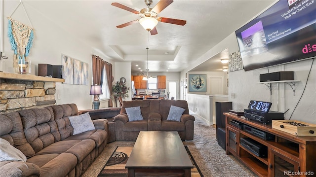 1086 Johnson St, Wiggins, CO 80654 - living area with a ceiling fan and a tray ceiling