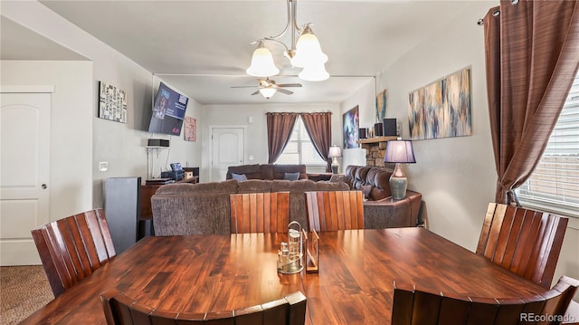 1086 Johnson St, Wiggins, CO 80654 - dining area with a chandelier and a ceiling fan