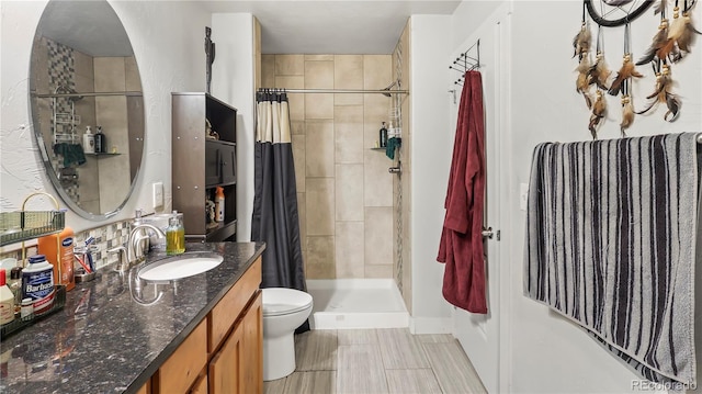 1086 Johnson St, Wiggins, CO 80654 - full bathroom featuring tiled shower, toilet, vanity, and baseboards