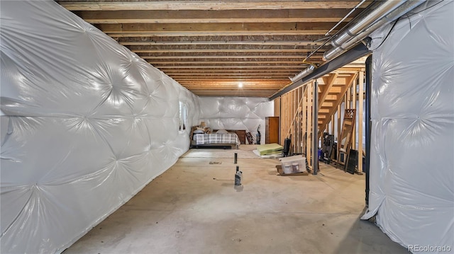 1086 Johnson St, Wiggins, CO 80654 - unfinished below grade area featuring stairs