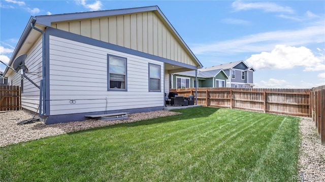 1086 Johnson St, Wiggins, CO 80654 - back of house featuring board and batten siding