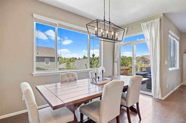 20855 Park Hollow Dr, Parker, CO 80138 - dining room with a chandelier, baseboards, and dark wood-style flooring