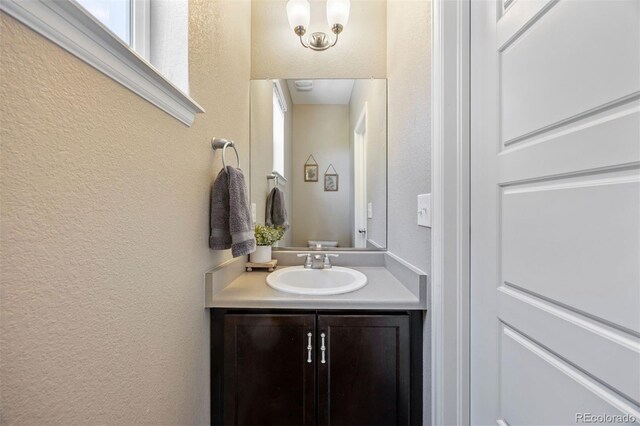 20855 Park Hollow Dr, Parker, CO 80138 - bathroom featuring a textured wall and vanity