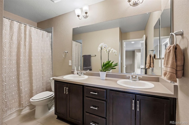 20855 Park Hollow Dr, Parker, CO 80138 - bathroom featuring tile patterned flooring, toilet, double vanity, a textured wall, and a shower with curtain