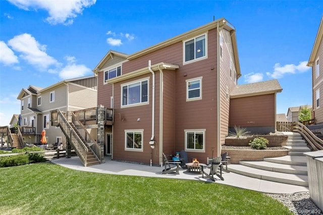 20855 Park Hollow Dr, Parker, CO 80138 - back of house featuring stairway, a patio area, an outdoor fire pit, a yard, and a deck