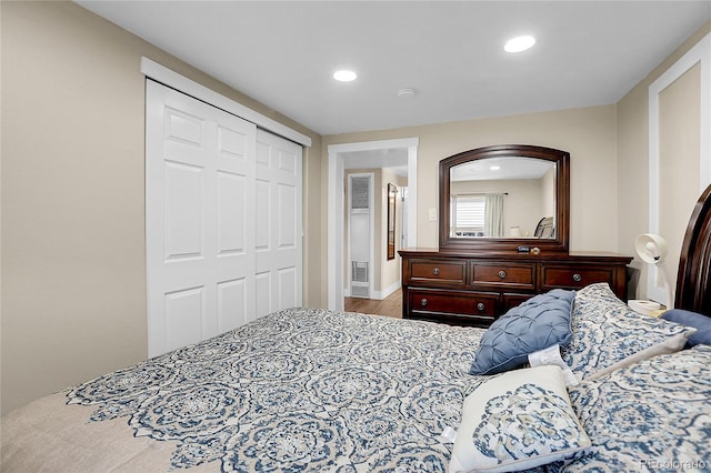 724 County Road 37, Brighton, CO 80603 - bedroom with a closet, wood finished floors, and recessed lighting