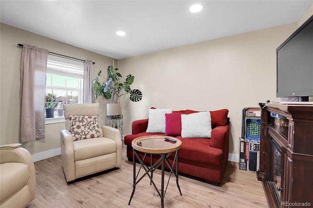 724 County Road 37, Brighton, CO 80603 - living room with baseboards, recessed lighting, and light wood finished floors