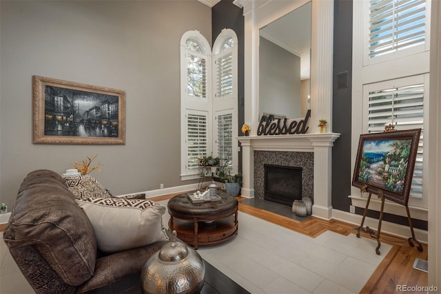 171 October Pl, Castle Rock, CO 80104 - living room with a high ceiling, a fireplace with flush hearth, and ornamental molding