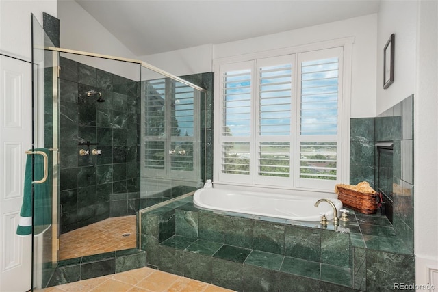 171 October Pl, Castle Rock, CO 80104 - bathroom featuring a garden tub, plenty of natural light, a shower stall, and vaulted ceiling