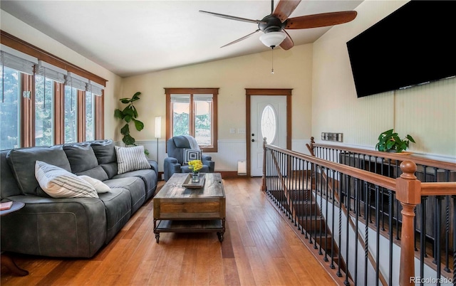 4805 S Blue Spruce Rd, Evergreen, CO 80439 - living area with vaulted ceiling, ceiling fan, wood-type flooring, and wainscoting