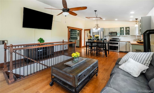 4805 S Blue Spruce Rd, Evergreen, CO 80439 - living area with ceiling fan, lofted ceiling, light wood finished floors, and recessed lighting