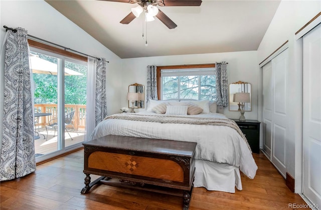 4805 S Blue Spruce Rd, Evergreen, CO 80439 - bedroom featuring vaulted ceiling, access to outside, multiple windows, wood finished floors, and ceiling fan
